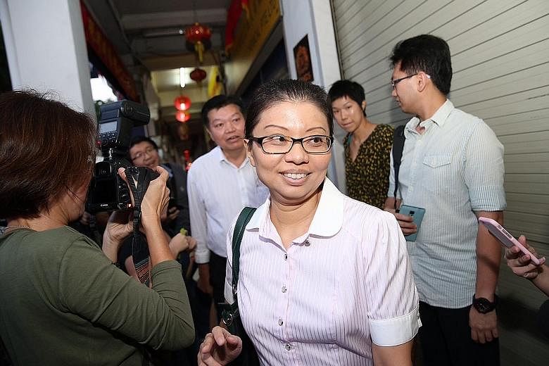 National Solidarity Party acting secretary-general Hazel Poa and president Sebastian Teo arriving at its headquarters on Aug 6 for talks among the opposition parties to avoid multi-cornered fights. Ms Poa has now quit the party and said that she will