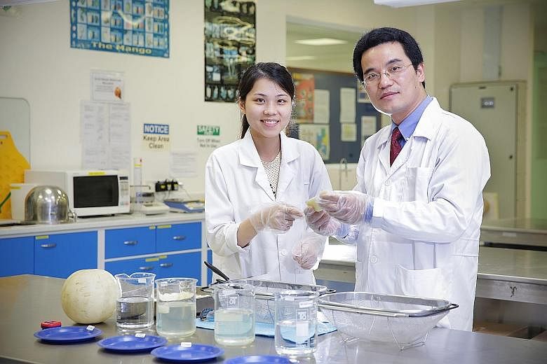 Ms Chong Jia Xin and Assistant Professor Yang Hongshun are part of the National University of Singapore team which developed a mixture to double the shelf life of cut fruit.