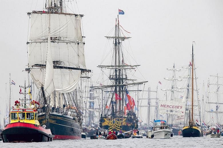 A parade of tall ships, surrounded by smaller, heritage ships, moving from Ijmuiden to Amsterdam in the Netherlands yesterday at the Sail Amsterdam event. The nautical festival first took place in 1975, on the 700th anniversary of the city, and has b