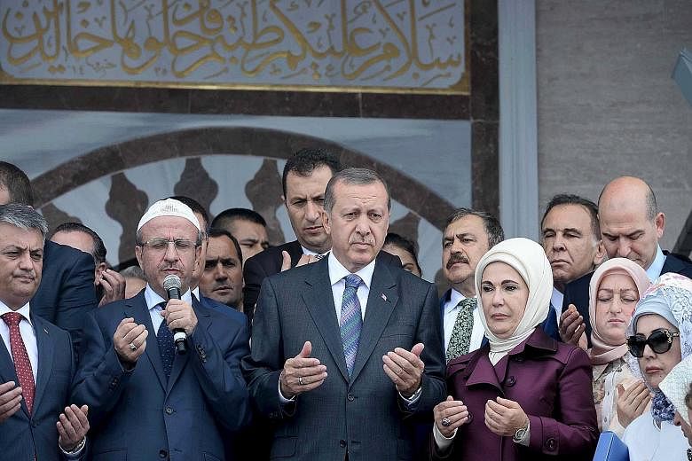 An ISIS video, the first in Turkish language, calls on Muslims in Turkey to revolt against President Tayyip Erdogan (front row, third from left)