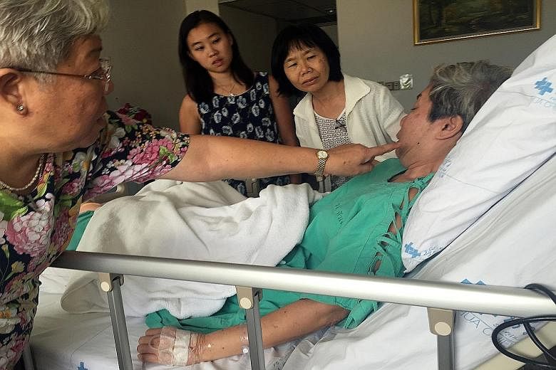[ ]Mr Ng Su Teck, whose wife Melisa Liu Rui Chun was killed in the blast, in hospital in Bangkok. The Straits Times understands he has been discharged and was due to return to Singapore last night. Ms Betty Ong (left) showing how her sister Jane's fa