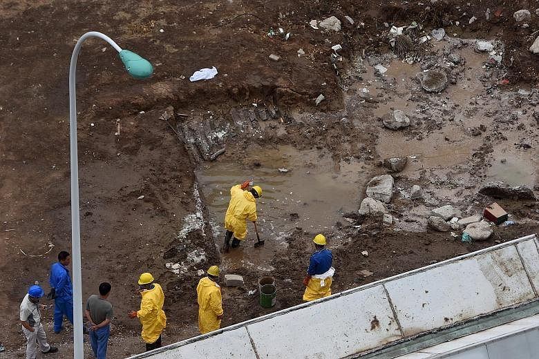 Workers removing water polluted by chemicals from the site of explosions in Tianjin last week. However, although cyanide levels in the river, sea and waste water in the evacuated area have risen sharply since the deadly blasts, drinking water in Tian