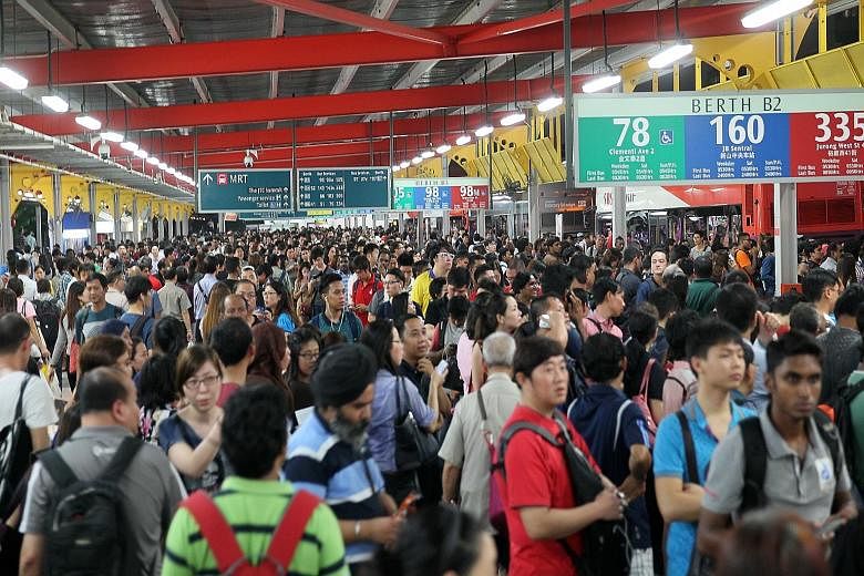 Crowds at the Jurong East bus interchange on July 7, when the North-South and East-West MRT lines broke down. The Defence Ministry says that the Singapore Armed Forces will work with the Land Transport Authority in the event of a major rail disruptio