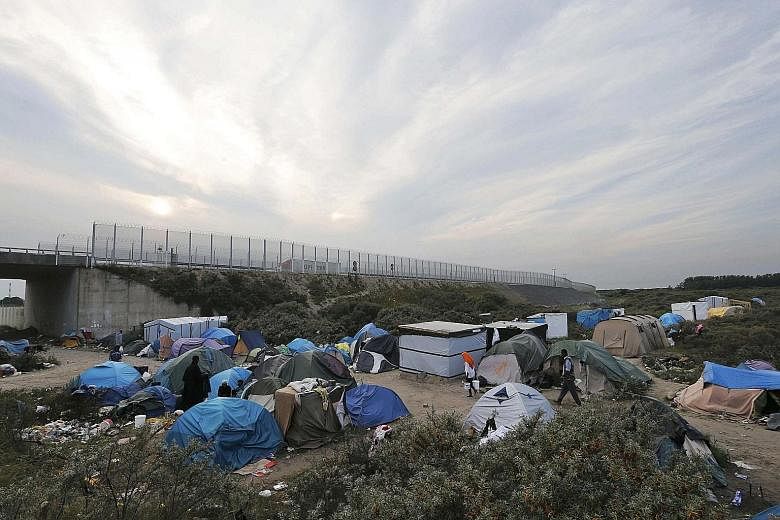 A makeshift camp for migrants called "The New Jungle" in Calais. Some 3,000 people from Africa, the Middle East and Asia are camped out in the French port city, waiting for a chance to cross over into Britain.