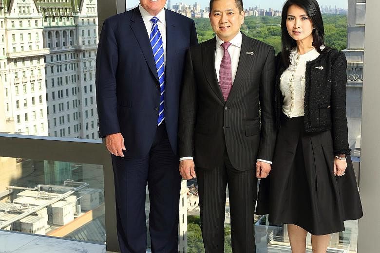 Tycoon Donald Trump with MNC Group CEO Hary Tanoesoedibjo and his wife Liliana at the signing ceremony last Friday. The Trump group will manage a six-star integrated lifestyle resort in Bali.