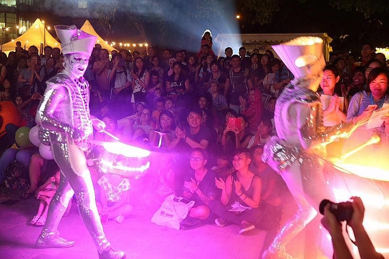 The annual Singapore Night Festival opened last night in the Bras Basah-Bugis precinct with a burst of colour and sound in a rousing drumming performance titled "Spark!" by Worldbeaters Music from the United Kingdom. The four-day music and art extrav