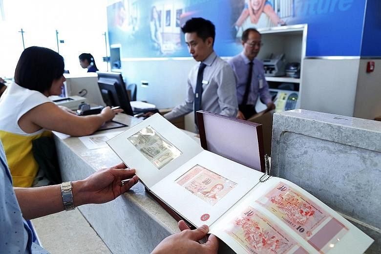 Some bank branches ran out of folders for the SG50 commemorative notes yesterday as long queues formed again. The note sets' cover fold and booklet had misspelt the name of Singapore's first president, Mr Yusof Ishak.