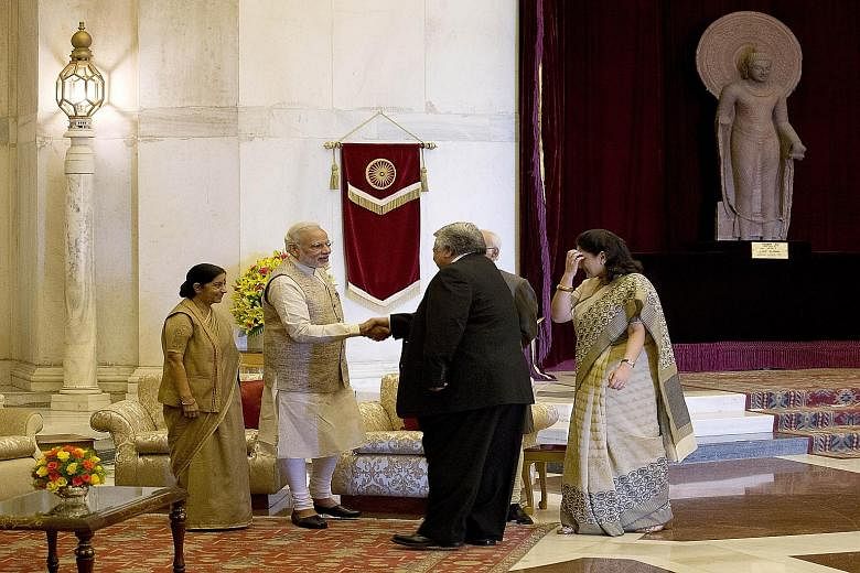 Indian Foreign Minister Sushma Swaraj (at far left) looking on as Prime Minister Narendra Modi welcomed Samoa's Premier Tuilaepa Lupesoliai Sailele Malielegaoi to the Presidential Palace yesterday. New Delhi is hosting the heads and representatives o