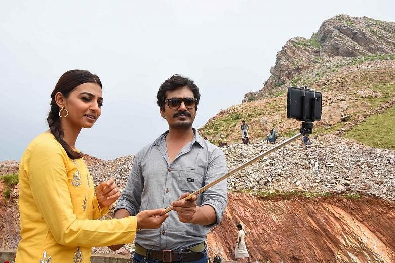 Actors Radhika Apte and Nawajuddin Siddique at a promotion for Manjhi - The Mountain Man, based on the true story of an Indian man who spent 22 years chiselling a path through a mountain to reduce the distance from his village to town, after his wife