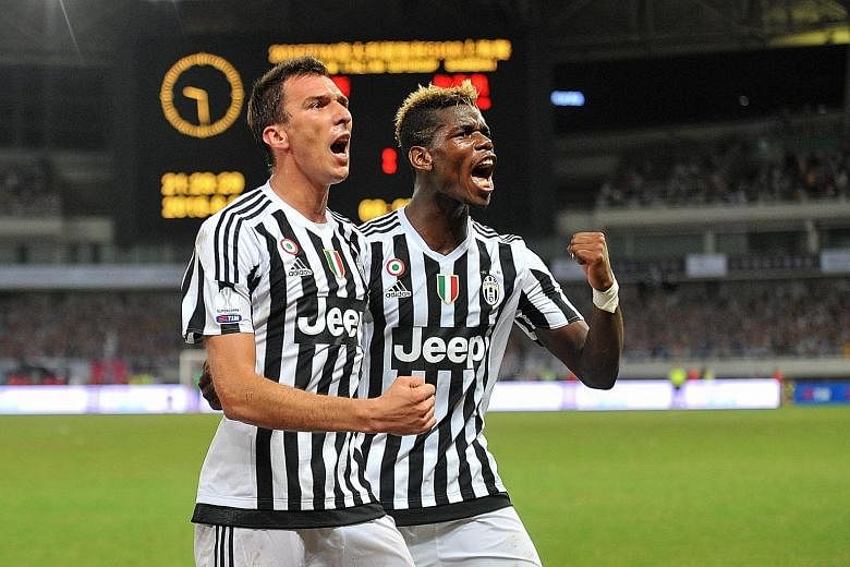 Mario Mandzukic (left) of Juventus celebrates with Paul Pogba after scoring during the Italian Super Cup win over Lazio earlier this month. Club CEO Beppe Moratta says Juve "can't be anywhere else but on top".