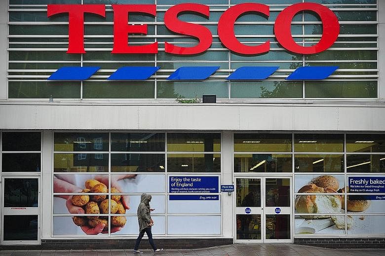 A Tesco supermarket in London. Britain's largest grocer was rocked by an accounting debacle last year. The fallout and declining sales saw its credit rating slashed to "junk" status in January. Selling its South Korean unit, valued at around $8 billi