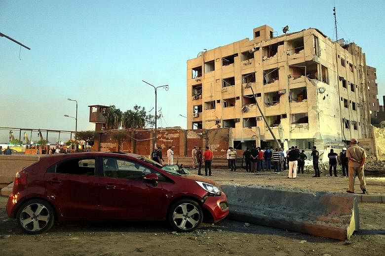 The scene where a bomb blew up next to a national security building in Cairo on Thursday, wounding at least 29 people. Militants claiming to be part of ISIS have taken responsibility for the attack.