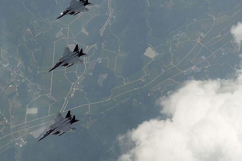 South Korean and US fighter jets flying over South Korea yesterday in a show of force.
