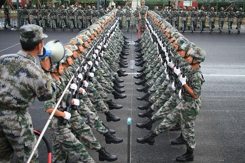 Soldiers training on July 23 for the massive military parade on Sept 3. China is sparing no effort to ensure that the parade is a roaring success, from shutting down factories and restricting the number of cars on the road to sprucing up Beijing with