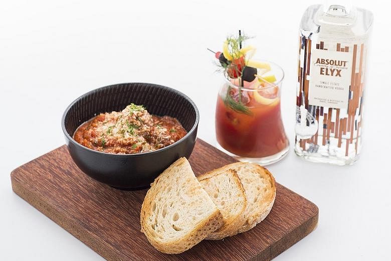 The Disgruntled Chef's Foie Gras Ricotta Beef Meatballs in tomato ragout, paired with a Kyoho Mary, which is the restaurant's spin on the traditional Bloody Mary cocktail.