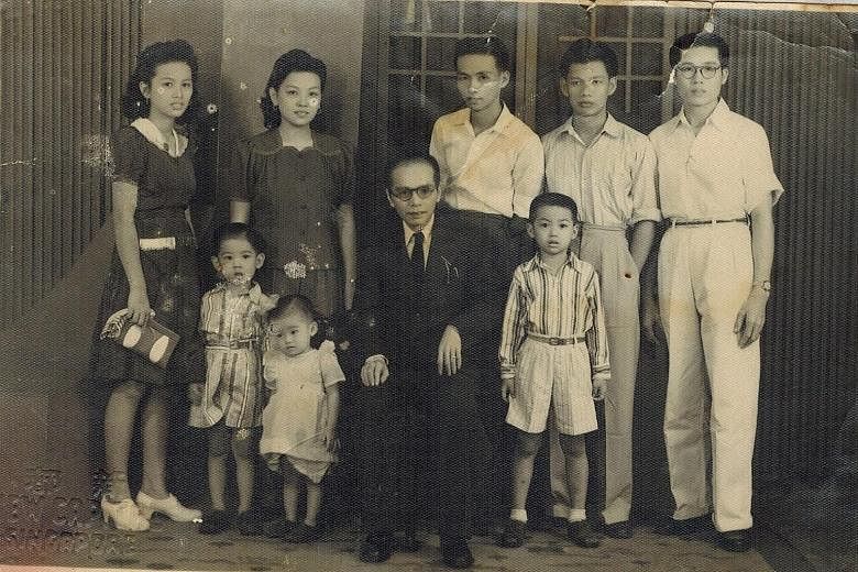 Madam Teo Buck Lang, 90, is carrying on her father's work at Sin Tong Kok. The Teo family, with patriarch Teo Peck Hiang seated in the centre and Madam Teo Buck Lang (second from left) and her husband, Mr Tan Wee Seng (far right).