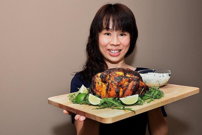 Housewife Lim Jen Jen makes her roast chicken with an Indian twist.