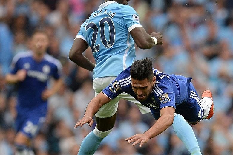 Eliaquim Mangala, seen here in a challenge with Chelsea striker Radamel Falcao, has formed a solid defensive partnership with City captain Vincent Kompany in the first two matches of the EPL season.