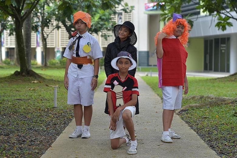The team from Yuying Secondary School - (foreground) Afiq Khan and (back row, from left) Leonard Yap Boon How, Firdayini Nasihah Afendi and Ian Tan Wen Yi- portraying characters from Roald Dahl's novel James And The Giant Peach in the festival's "Boo