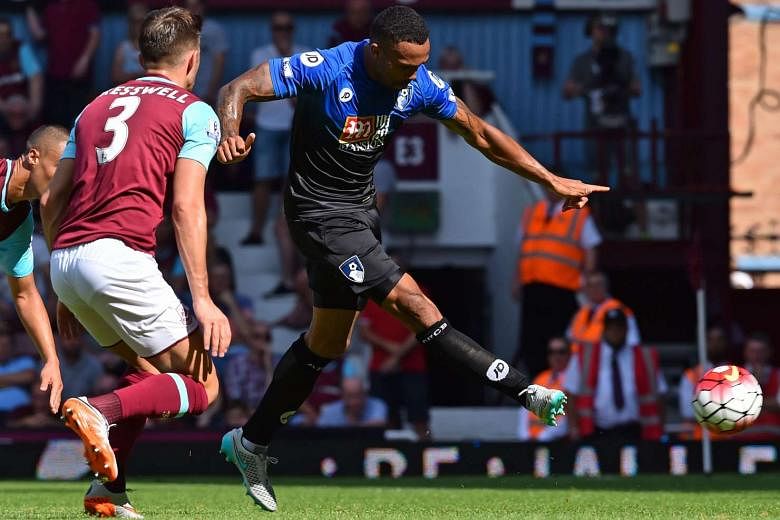 Callum Wilson (right) has a good outing at Upton Park with his hat-trick helping Bournemouth notch their first EPL victory. 
