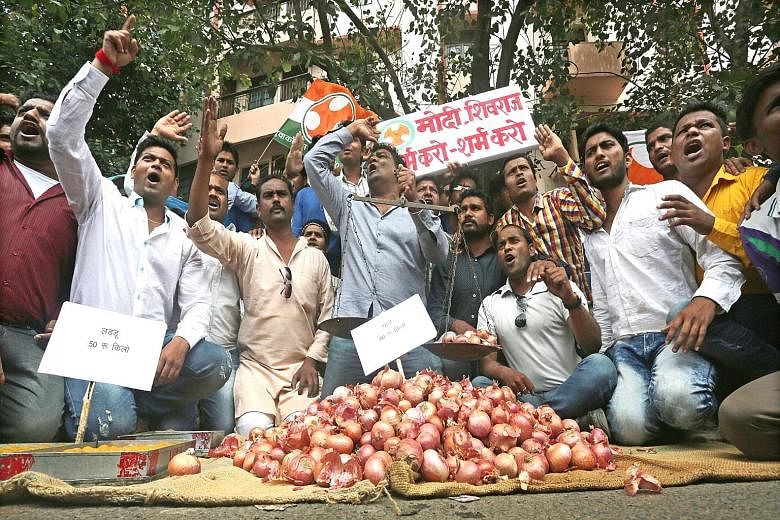 Congress party workers in Bhopal protesting against onion prices, which soared to two-year highs in India's largest onion market in the state of Maharashtra.