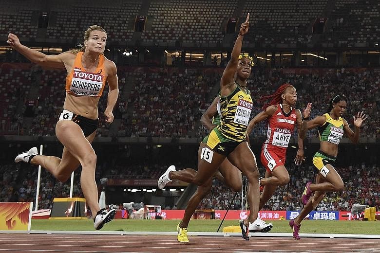 Shelly-Ann Fraser-Pryce (centre) holds off Dafne Schippers (left) to secure gold in the 100 metres. Schippers recently switched to the sprints from the hepathlon.