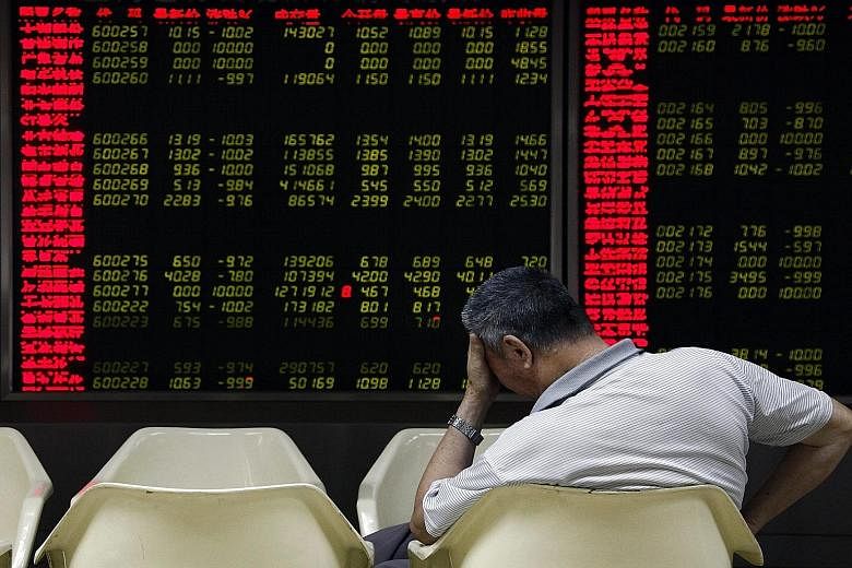 An investor monitoring stock data in Beijing yesterday. Jumpy investors see the latest market turmoil as a potential forerunner of a new full-blown crisis.