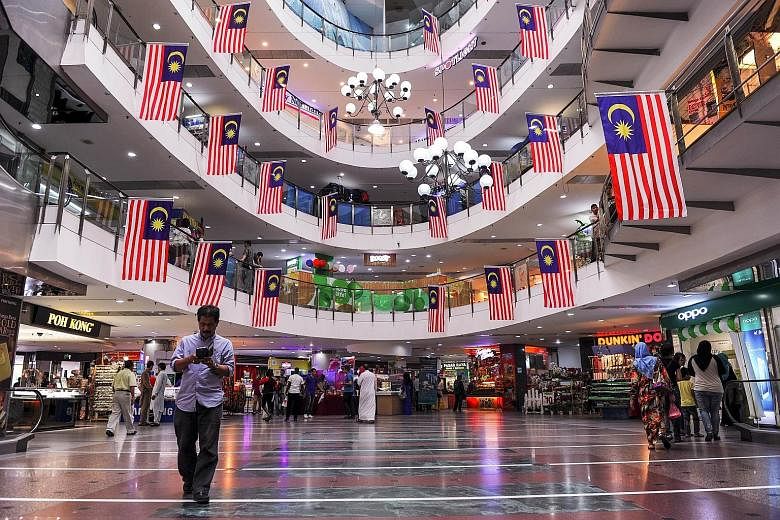 Malaysian national flags adorning a shopping mall in Ampang, Kuala Lumpur, ahead of the country's Independence Day celebrations on Aug 31.