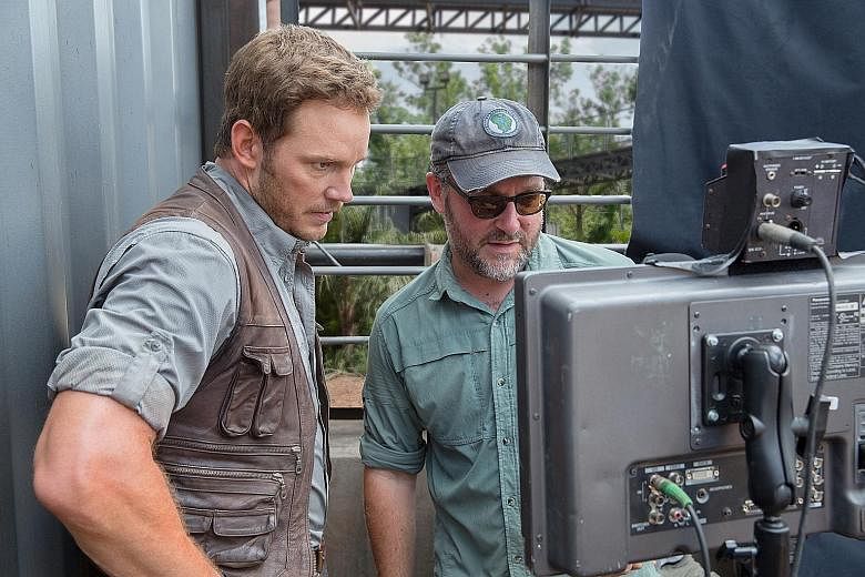Director Colin Trevorrow (right) with lead star Chris Pratt on the set of Jurassic World.