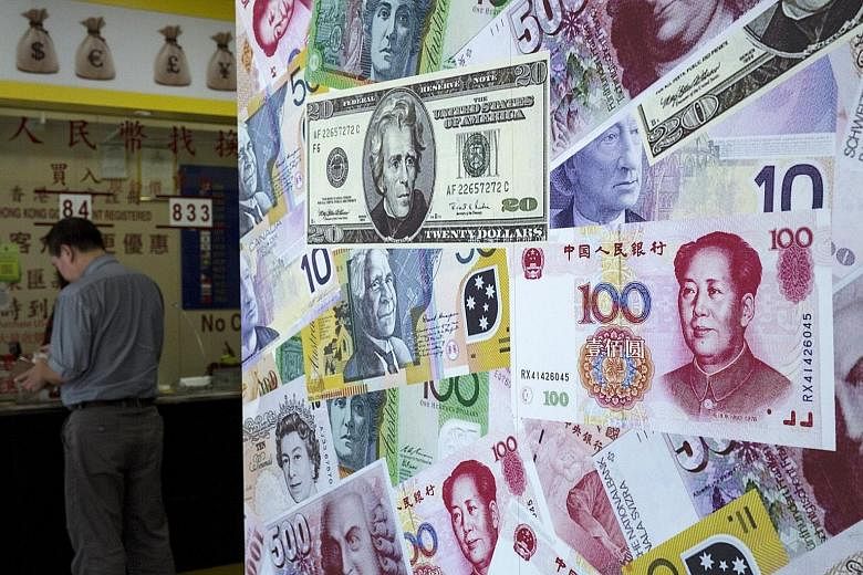 A foreign exchange store in Hong Kong. The Singdollar has weakened, following the devaluation of China's yuan and amid market speculation of further Monetary Authority of Singapore policy easing.