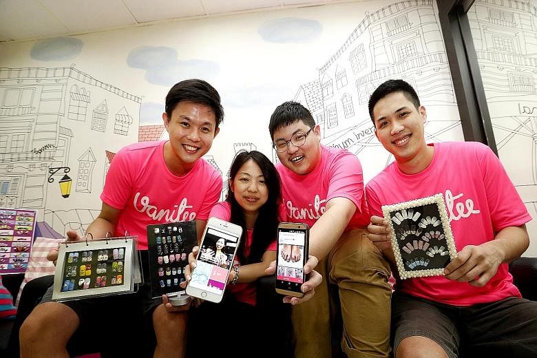 Mr Yang Cheng (in blue) and Mr Jason Wang are co-founders of the Sure Beautyplace application. (From left) Mr Douglas Gan, Ms Kuik Xiaochi, Mr Meters Ang and Mr Choy Peng Kong, founders of the Vanitee app, which has seen over 1,900 customers use it t