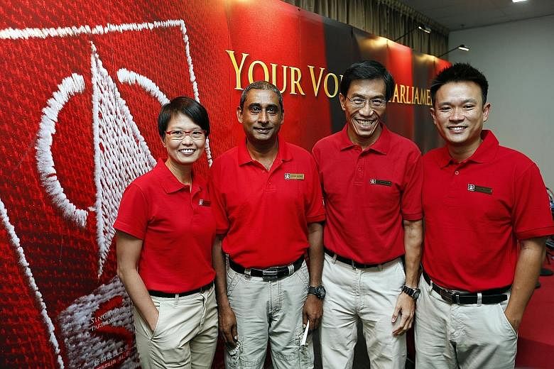 SDP secretary-general Chee Soon Juan (third from left) and chairman Jeffrey George flanked by Ms Chong Wai Fung and Mr Khung Wai Yeen, the party's candidates in the election. Last night, Mr Khung was seen on a walkabout in Marsiling-Yew Tee GRC and M