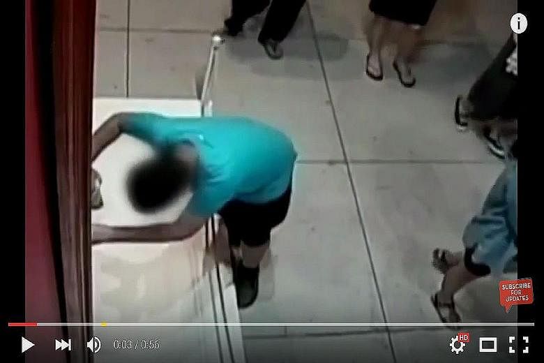 A video screengrab shows the boy accidentally punching a hole in a centuries-old oil painting by Italian artist Paolo Porpora, after he tripped at an exhibition in Taiwan. The painting has been restored and put back on show.
