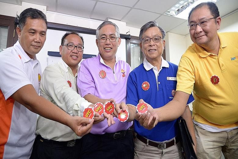 Holding the 'Vote for Change" campaign badges are (from left) Democratic Progressive Party chairman Mohamad Hamim Aliyas, Singapore Democratic Alliance chief Desmond Lim, People's Power Party chief Goh Meng Seng, SingFirst chief Tan Jee Say, and Refo
