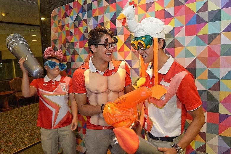 Swimmers (from left) Tao Li, Joseph Schooling and Quah Zheng Wen clowning around at an instant photo booth at the Multi-Million Dollar Award Programme presentation ceremony last night. Schooling and Quah were joint top earners, receiving cash awards 