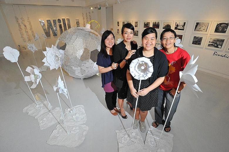 Eco-artist Rene Ong (in red), in her 40s, worked with four patients, one of whom was student Summer Tham (in polka-dot outfit), 16, to produce The Life Within Transcends The Ticking Time Bomb (in the background). With them are project coordinators Lo