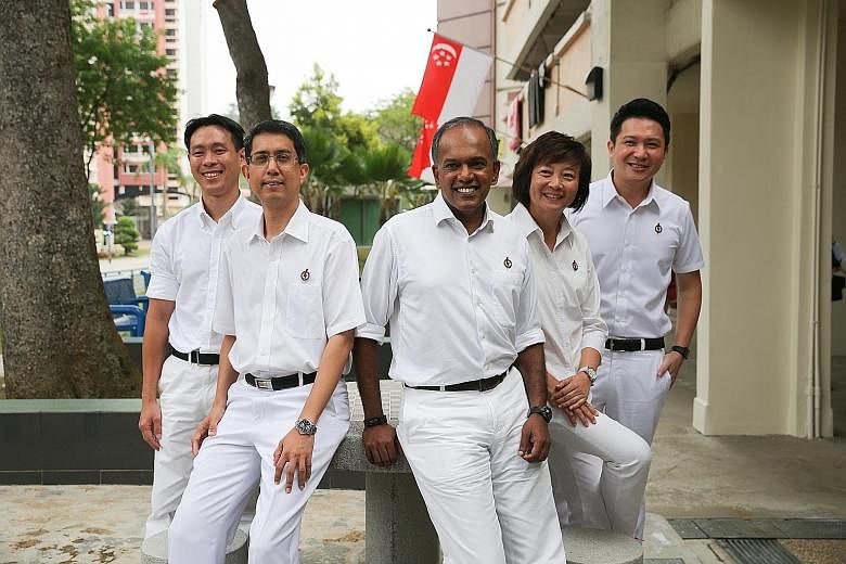 Law and Foreign Minister K. Shanmugam yesterday introduced the PAP team for Nee Soon GRC, which he leads. They are (from left) Acres chief executive Louis Ng, who is one of two new candidates; Associate Professor Muhammad Faishal Ibrahim and Ms Lee B
