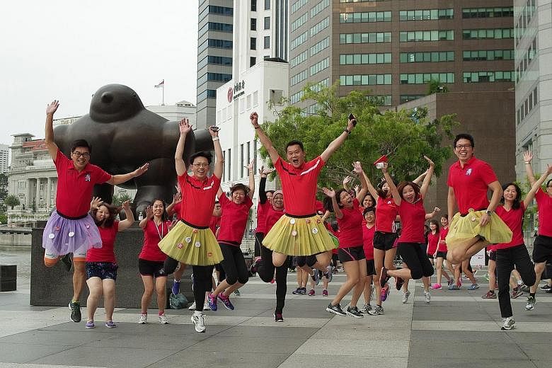 About 300 Great Eastern staff, led by chief executive officer Khoo Kah Siang, participated in a charity walk from their office at Pickering Street yesterday. Khoo, together with 10 male members of GE's senior management team, donned tutu skirts for t