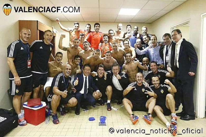 Owner Peter Lim (front row, third from right) celebrating in the dressing room with his team's members on Tuesday.