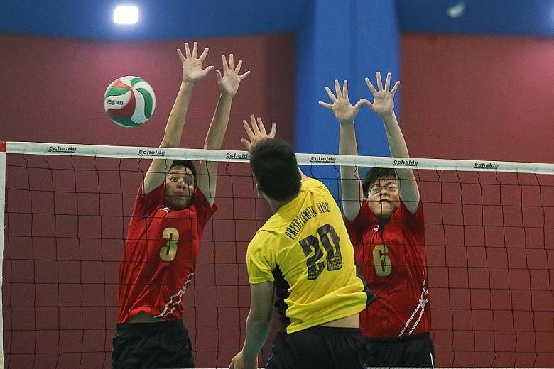 Bukit Panjang Government High (in red) came back from 11-14 to beat Presbyterian High 17-15 in the decisive fifth set.