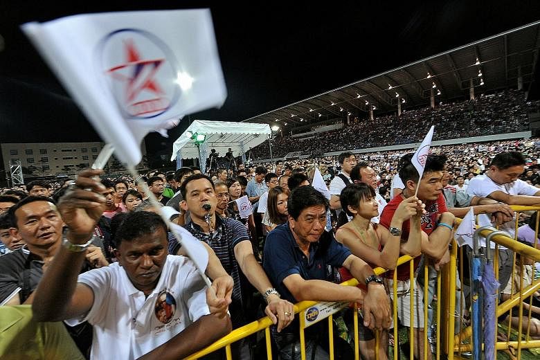 Supporters of the People's Action Party (left) and of the Singapore People's Party at the parties' respective rallies during the 2011 General Election campaign. The Elections Department yesterday asked contesting candidates in next month's polls to r
