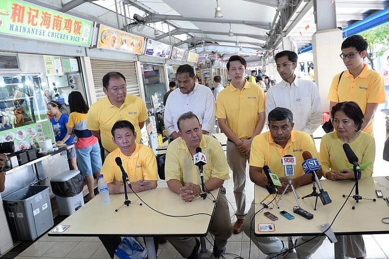 The Reform Party yesterday unveiled its first batch of candidates at a hawker centre in Telok Blangah. Contesting West Coast GRC are (seated, from left) property agent Darren Soh and RP secretary-general Kenneth Jeyaretnam; RP chairman Andy Zhu (stan