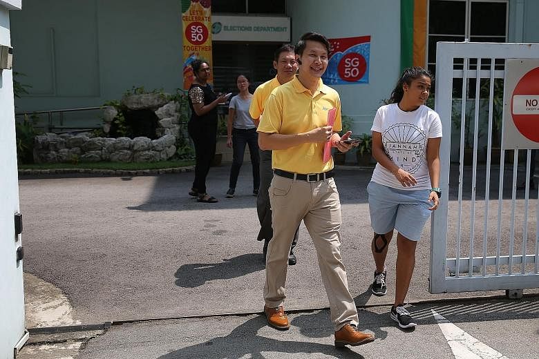 Among those who turned up yesterday were Reform Party members Andy Zhu (foreground) and Darren Soh. Singapore Democratic Alliance member Harminder Pal Singh also handed in forms for his party's candidates yesterday. People's Action Party representati