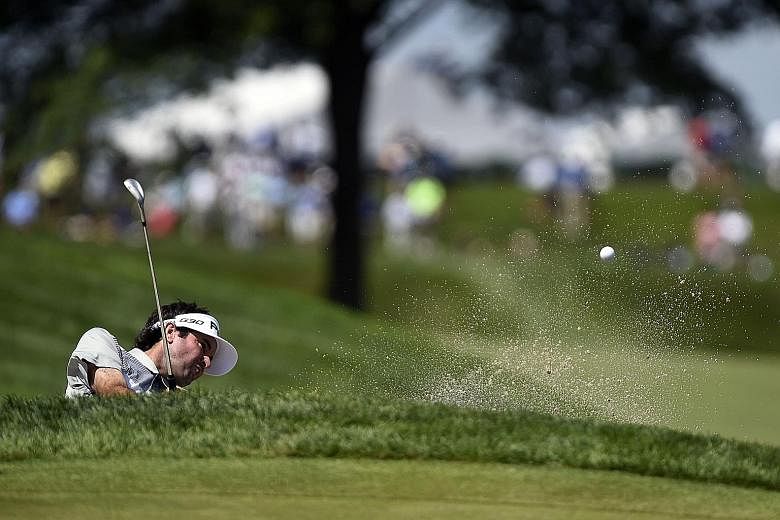Bubba Watson plays his way out of a bunker at the sixth green during the first round of The Barclays on Thursday. His five-under 65 gives him a four-way share of the lead.