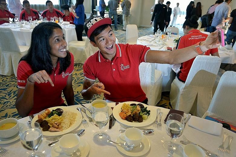 Sprinters Shanti Pereira and Calvin Kang show off their high- performance meals at Swissotel The Stamford before the SEA Games. A well-balanced diet is a vital factor in maximising the performance of runners.