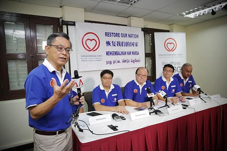 Mr Tan Jee Say of the Singaporeans First party speaking to the media yesterday. The SingFirst candidates introduced were (seated, from left) Mr Tan Peng Ann (hidden), Mr Wong Soon Hong, Dr Ang Yong Guan, Dr David Foo Ming Jin and Mr Sukdeu Singh.