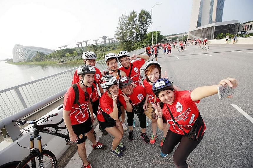 Participants of The Straits Times Ride pose for a wefie along the Benjamin Sheares Bridge. 