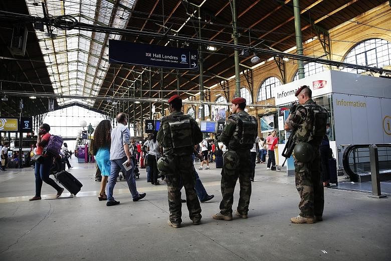 Three French soldiers patrolling the Gare du Nord train station in Paris last Friday. French Interior Minister Bernard Cazeneuve said multinational patrols already existed in major stations, but that ministers had agreed to increase their "efficiency