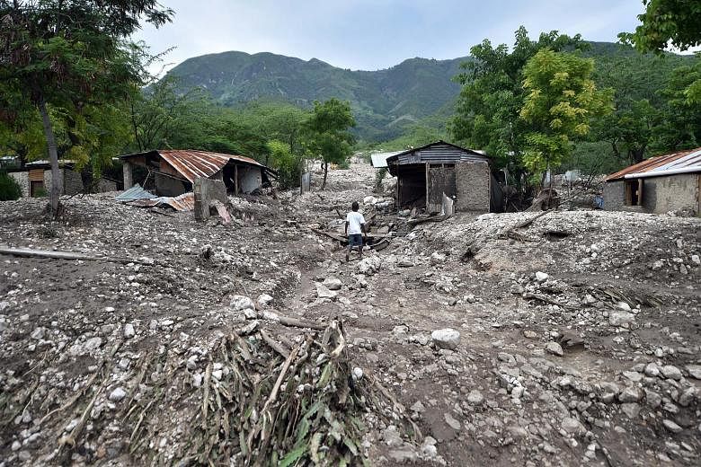 Villages, communities and homes were ravaged after a mudslide, caused by the heavy rains and strong wind from Tropical Storm Erika, pummelled Montrouis, Haiti, on Saturday. The monumental storm left a trail of devastation in its wake, damaging countl