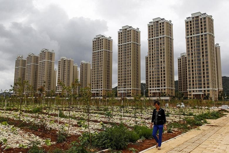 Newly built residential buildings in the Chenggong new district of Kunming, Yunnan province. China's government has been capitalising on signs that the housing market may be stabilising when the rest of the Chinese economy is still struggling.